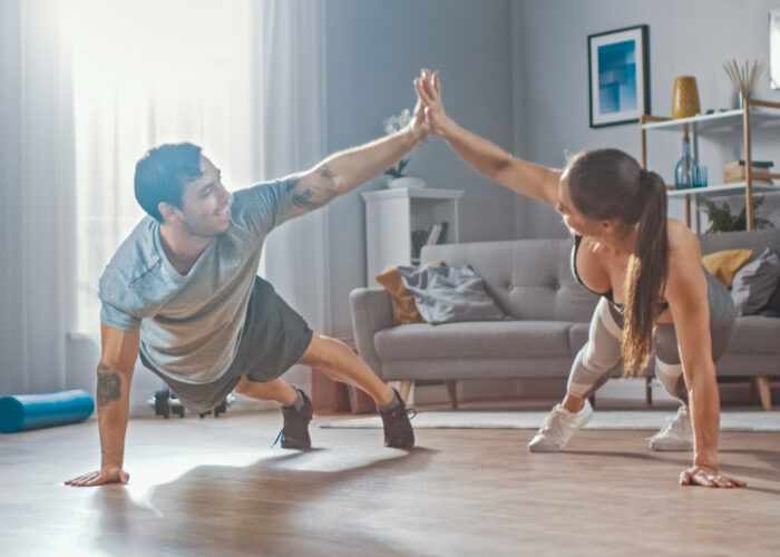 Couple working out in home gym
