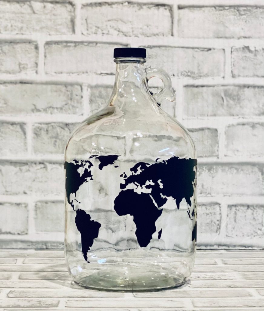 Decorative travel fund jug with world map design