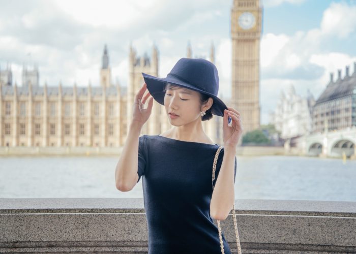 Woman Standing across the river from Big Ben in London